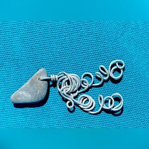 Wire wrapped natural finger lakes lucky stone pendant.